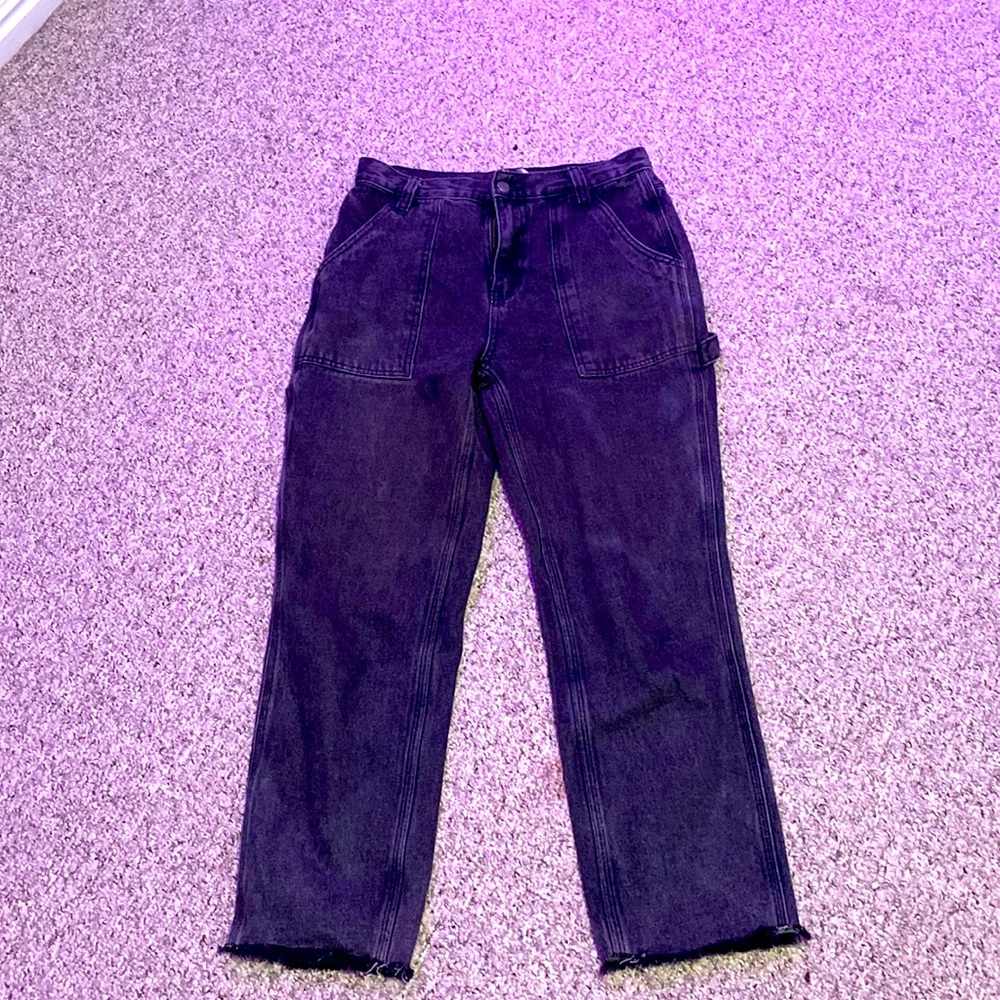 Loose half cargo jeans. They are cut at the bottom with loose strings.